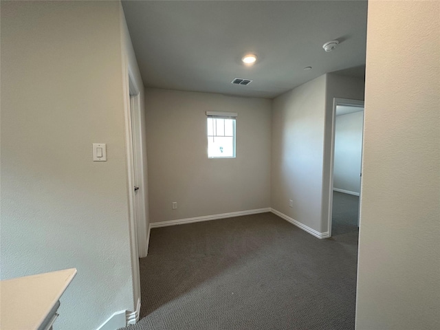 123 Monarch Way, Wylie, TX 75098 - unfurnished room featuring dark carpet, baseboards, and a smoke detector
