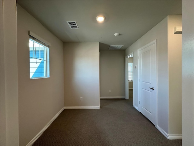 123 Monarch Way, Wylie, TX 75098 - spare room featuring baseboards and dark colored carpet
