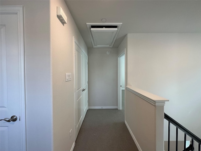 123 Monarch Way, Wylie, TX 75098 - corridor with attic access, dark carpet, an upstairs landing, and baseboards