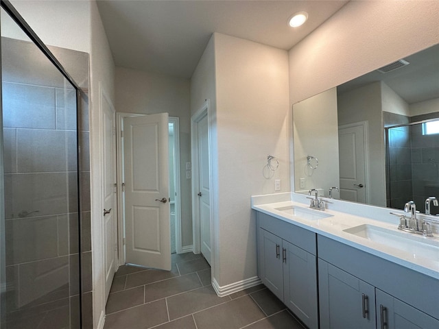 123 Monarch Way, Wylie, TX 75098 - full bathroom with double vanity, a shower stall, tile patterned flooring, and baseboards