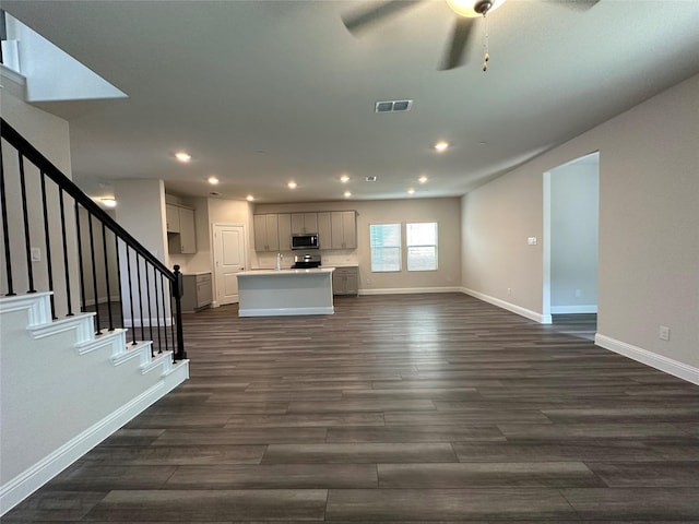 123 Monarch Way, Wylie, TX 75098 - unfurnished living room featuring recessed lighting, ceiling fan, dark wood-style flooring, baseboards, and stairway
