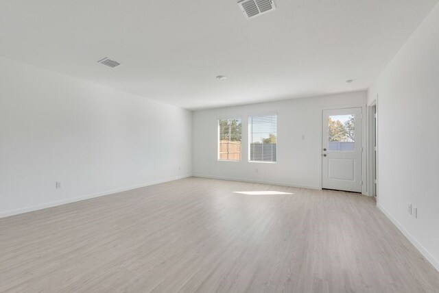 1937 Kiwi Dr, Royse City, TX 75189 - spare room featuring plenty of natural light, light wood-style floors, and baseboards