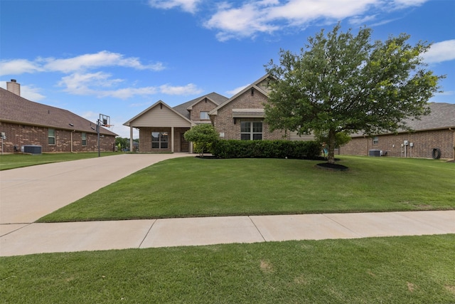 1028 Morningside Dr, Burleson, TX 76028 - view of front of home featuring brick siding, central air condition unit, and a front lawn