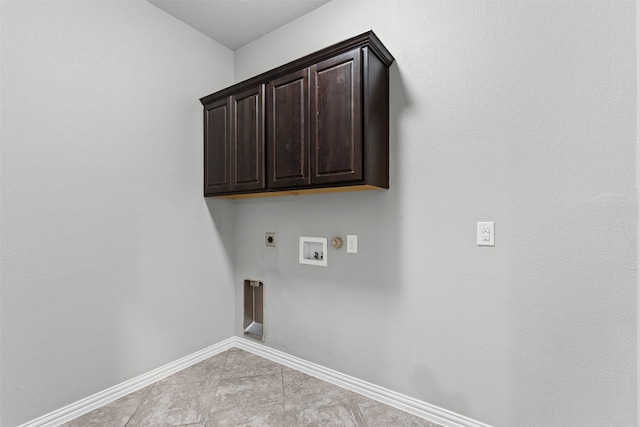 1028 Morningside Dr, Burleson, TX 76028 - laundry room featuring electric dryer hookup, hookup for a washing machine, baseboards, cabinet space, and light tile patterned flooring