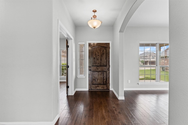 1028 Morningside Dr, Burleson, TX 76028 - entryway with arched walkways, dark wood-type flooring, and baseboards