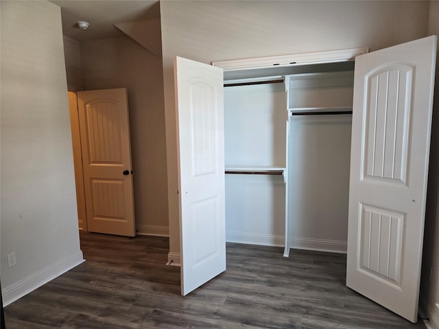 632 Yucca Ct, Aledo, TX 76008 - unfurnished bedroom with a closet, baseboards, and dark wood-style floors
