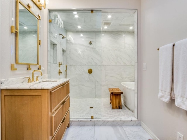 104 Crestwood Dr, Fort Worth, TX 76107 - full bath with marble finish floors, a freestanding tub, vanity, a marble finish shower, and baseboards