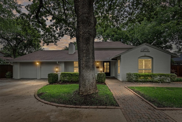 104 Crestwood Dr, Fort Worth, TX 76107 - view of front of home featuring a chimney, a garage, concrete driveway, and roof with shingles