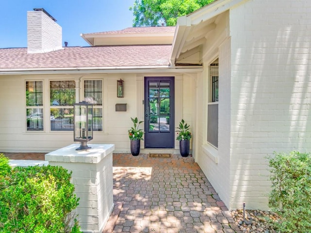 104 Crestwood Dr, Fort Worth, TX 76107 - property entrance with a chimney and roof with shingles