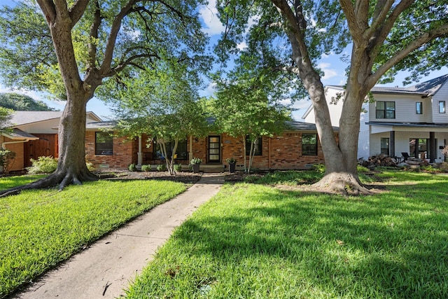 10916 Ferndale Rd, Dallas, TX 75238 - view of front of home with brick siding and a front yard
