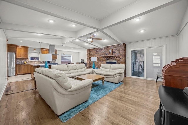 10916 Ferndale Rd, Dallas, TX 75238 - living area featuring a ceiling fan, light wood finished floors, and a brick fireplace