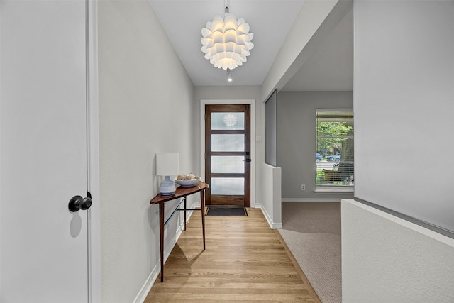 10916 Ferndale Rd, Dallas, TX 75238 - foyer entrance featuring baseboards, light wood-type flooring, and light carpet