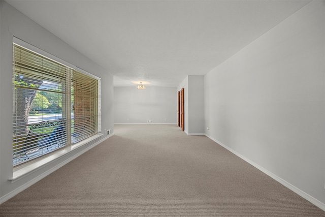 10916 Ferndale Rd, Dallas, TX 75238 - empty room with baseboards and carpet floors