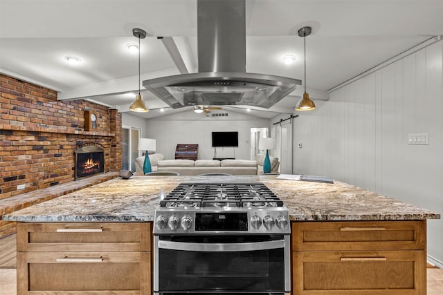 10916 Ferndale Rd, Dallas, TX 75238 - kitchen featuring gas range, island exhaust hood, light stone countertops, open floor plan, and a fireplace