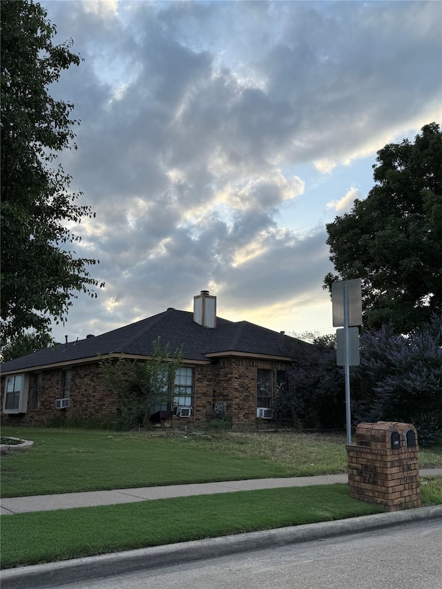 801 Micarta Dr, Mesquite, TX 75181 - view of front facade featuring a yard, a chimney, and brick siding