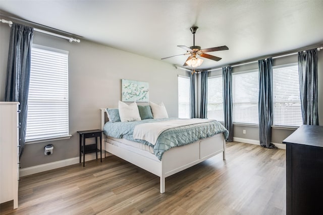 3501 Brazos St, Melissa, TX 75454 - bedroom with light wood-type flooring, baseboards, and a ceiling fan