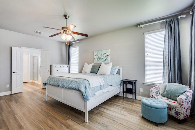 3501 Brazos St, Melissa, TX 75454 - bedroom featuring multiple windows, wood finished floors, and ceiling fan
