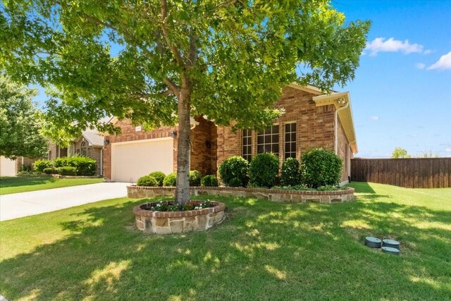 1407 Deer Hollow Dr, Arlington, TX 76002 - obstructed view of property featuring brick siding, driveway, and an attached garage