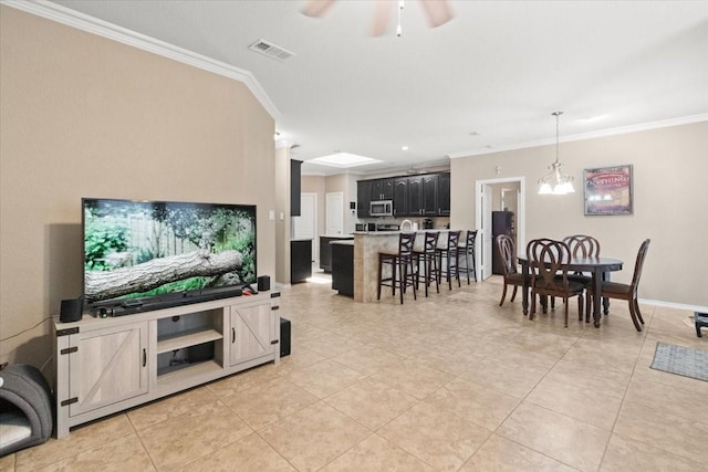 1407 Deer Hollow Dr, Arlington, TX 76002 - living room with ornamental molding, light tile patterned flooring, a ceiling fan, baseboards, and a chandelier