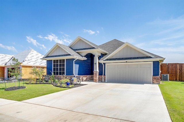 1733 Reverie Rd, Burleson, TX 76028 - view of front of house with brick siding, board and batten siding, an attached garage, and concrete driveway