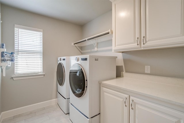 1733 Reverie Rd, Burleson, TX 76028 - washroom featuring washer and clothes dryer and cabinet space