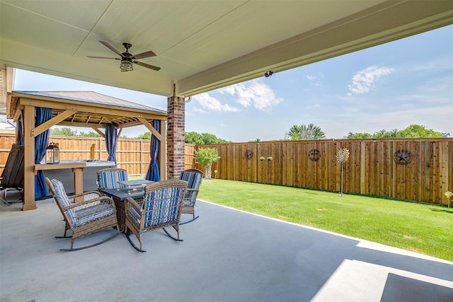 1733 Reverie Rd, Burleson, TX 76028 - fenced backyard featuring a ceiling fan, a patio, a gazebo, and outdoor dining area