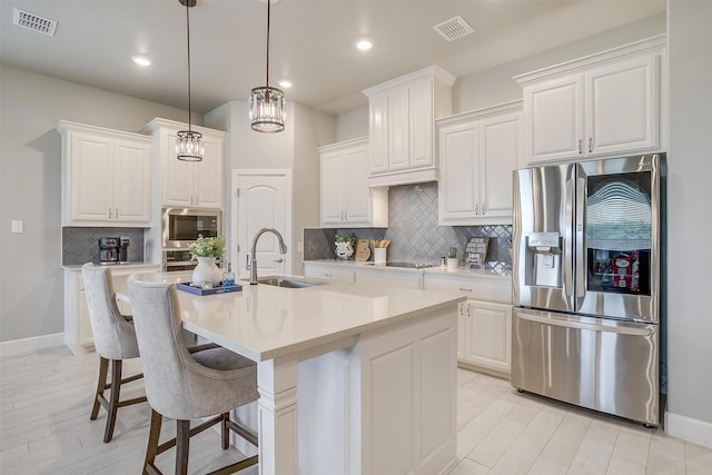 1733 Reverie Rd, Burleson, TX 76028 - kitchen with stainless steel refrigerator with ice dispenser, backsplash, white cabinets, light countertops, and recessed lighting
