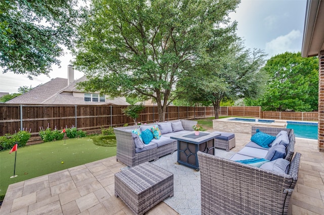 590 Willow Ridge Cir, Prosper, TX 75078 - fenced backyard featuring a putting area, outdoor lounge area, a patio area, and an in-ground hot tub
