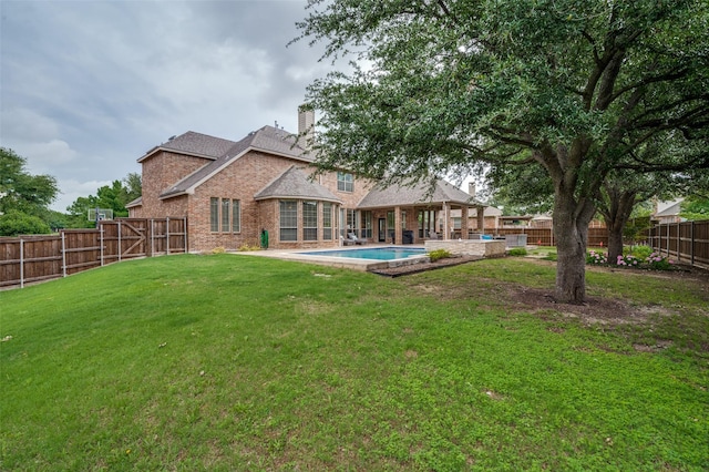 590 Willow Ridge Cir, Prosper, TX 75078 - rear view of property featuring brick siding, a chimney, and a patio