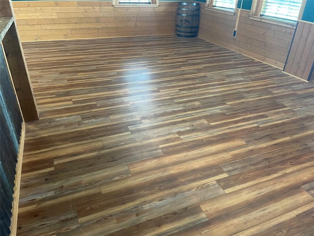 209 E Pine St, Nocona, TX 76255 - detailed view of wood finished floors and wooden walls