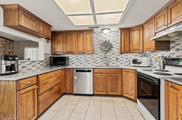 1710 Goliad Dr, Garland, TX 75042 - kitchen with electric range oven, dishwasher, a sink, under cabinet range hood, and brown cabinetry