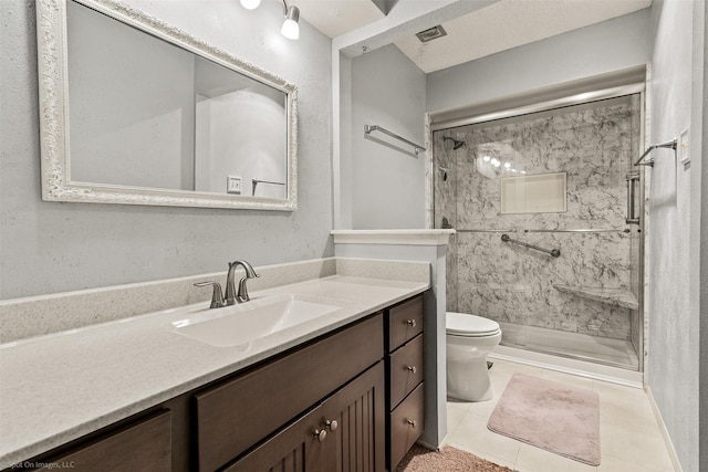 1710 Goliad Dr, Garland, TX 75042 - bathroom with toilet, a stall shower, vanity, and tile patterned flooring