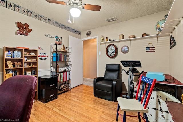 1710 Goliad Dr, Garland, TX 75042 - office space with wood finished floors, a textured ceiling, and a ceiling fan