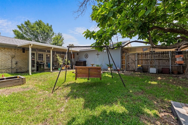 1710 Goliad Dr, Garland, TX 75042 - back of house with a gate and a patio area
