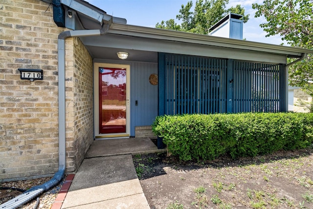 1710 Goliad Dr, Garland, TX 75042 - entrance to property with brick siding and a chimney
