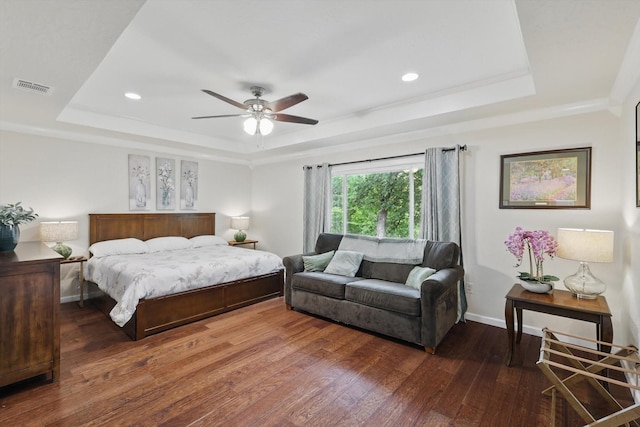1520 Oakhurst Scenic Dr, Fort Worth, TX 76111 - bedroom with a tray ceiling, hardwood / wood-style flooring, baseboards, recessed lighting, and a ceiling fan