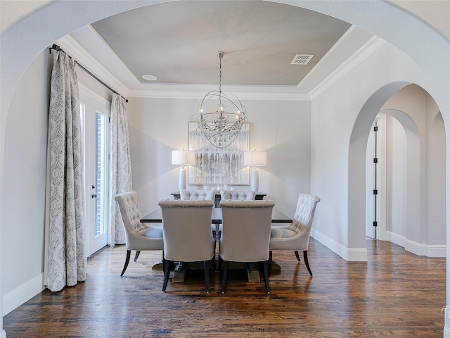 3421 Greenbrier Dr, Frisco, TX 75033 - dining space with wood finished floors, baseboards, ornamental molding, and arched walkways