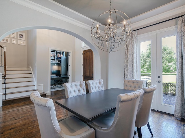 3421 Greenbrier Dr, Frisco, TX 75033 - dining room with arched walkways, wood finished floors, stairs, crown molding, and french doors