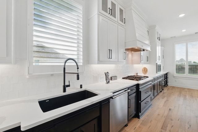 1301 Limestone Ridge Rd, Mansfield, TX 76063 - kitchen with a sink, custom range hood, appliances with stainless steel finishes, white cabinetry, and recessed lighting