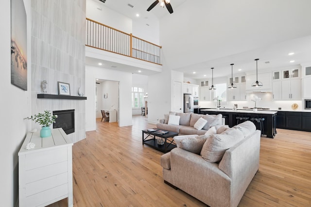 1301 Limestone Ridge Rd, Mansfield, TX 76063 - living area featuring a ceiling fan, light wood-style floors, plenty of natural light, a high ceiling, and recessed lighting