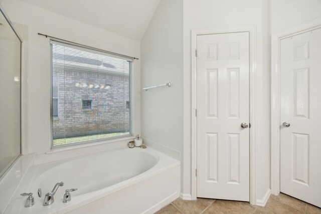 2748 Thorncreek Ln, Fort Worth, TX 76177 - full bathroom featuring a bath, lofted ceiling, and tile patterned floors