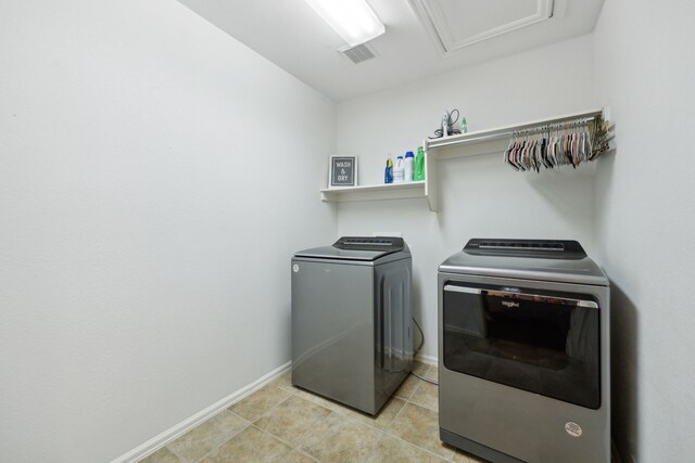 2748 Thorncreek Ln, Fort Worth, TX 76177 - washroom featuring washing machine and dryer, baseboards, and light tile patterned floors
