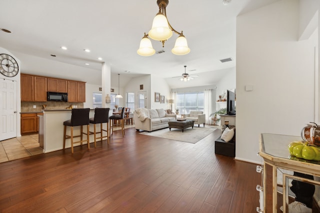 2748 Thorncreek Ln, Fort Worth, TX 76177 - living area featuring a ceiling fan, dark wood-style flooring, recessed lighting, baseboards, and lofted ceiling