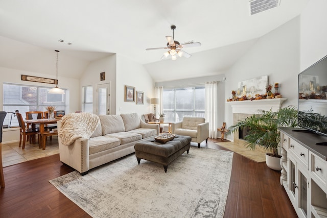 2748 Thorncreek Ln, Fort Worth, TX 76177 - living room featuring lofted ceiling, ceiling fan, dark wood-style flooring, and a fireplace with flush hearth