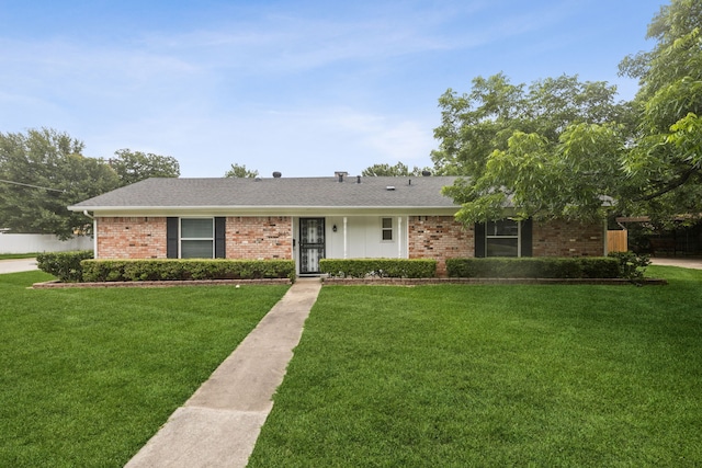 2140 Barbell Ln, Fort Worth, TX 76111 - ranch-style house with brick siding, a front lawn, and a shingled roof