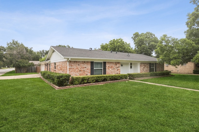 2140 Barbell Ln, Fort Worth, TX 76111 - ranch-style house with brick siding, a front lawn, and a shingled roof