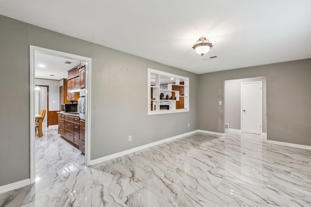 2140 Barbell Ln, Fort Worth, TX 76111 - hallway featuring baseboards, light marble finish floors, and recessed lighting