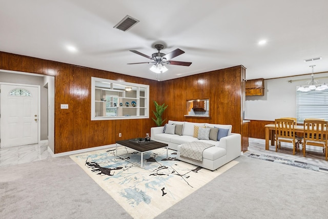 2140 Barbell Ln, Fort Worth, TX 76111 - unfurnished living room with wooden walls, ceiling fan, baseboards, and carpet floors