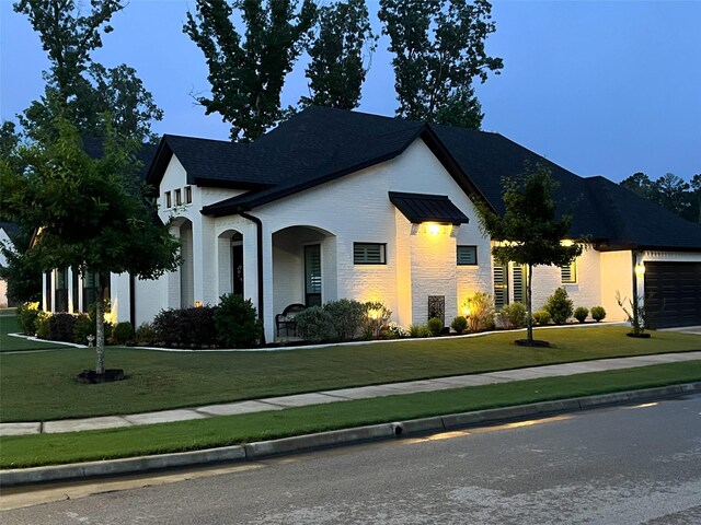 9035 Shallow Cv, Tyler, TX 75703 - french provincial home with a front lawn, an attached garage, and brick siding