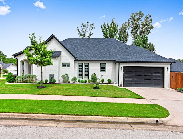 9035 Shallow Cv, Tyler, TX 75703 - view of front of house featuring a garage, brick siding, driveway, and roof with shingles